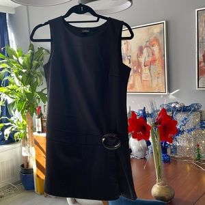 Bebe. Black mini flared dress with brooch. Size S.